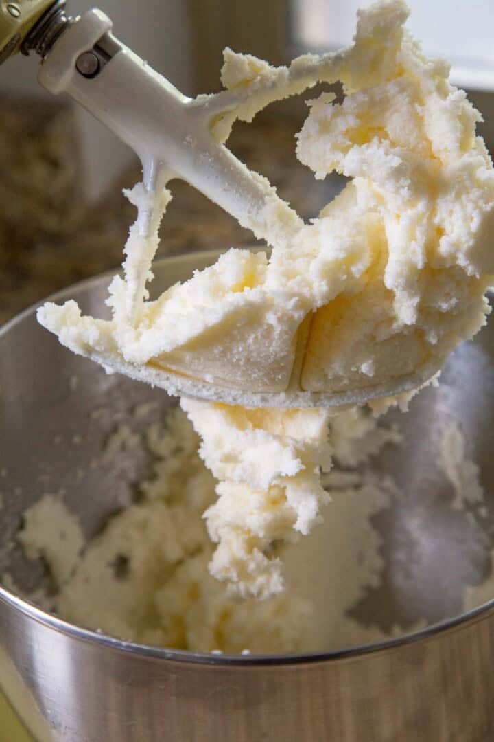 butter and sugar creamed together on a paddle attachment of a stand mixer.