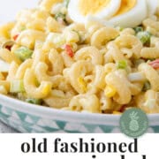 macaroni salad topped with slices of hard boiled eggs.