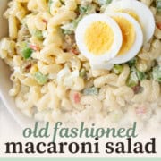 macaroni salad topped with slices of hard boiled eggs.