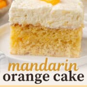 slice of mandarin orange cake topped with cool whip and a mandarin orange slice.