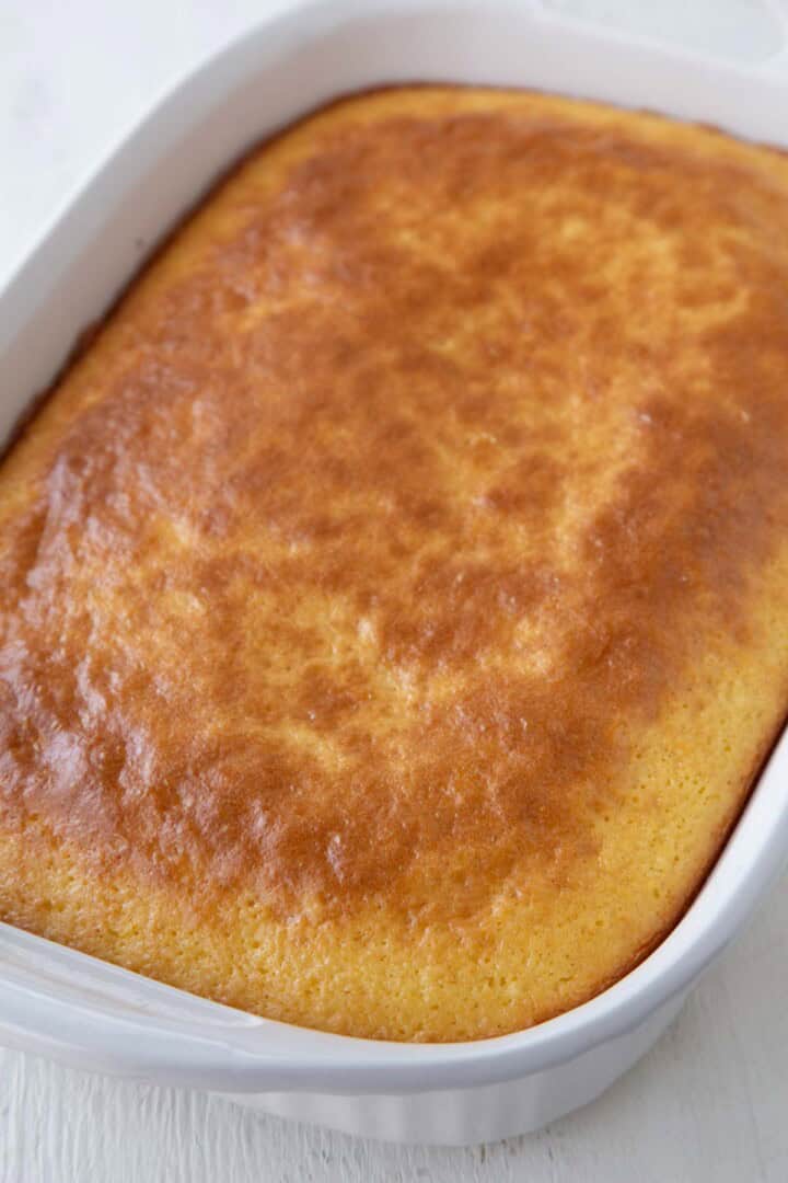 baked mandarin orange cake in a 13x9-inch pan.