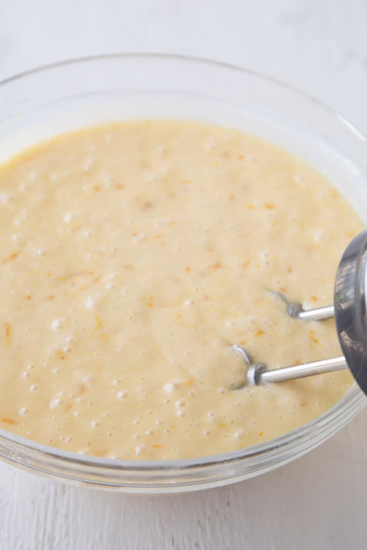 cake batter with mandarin oranges in it.