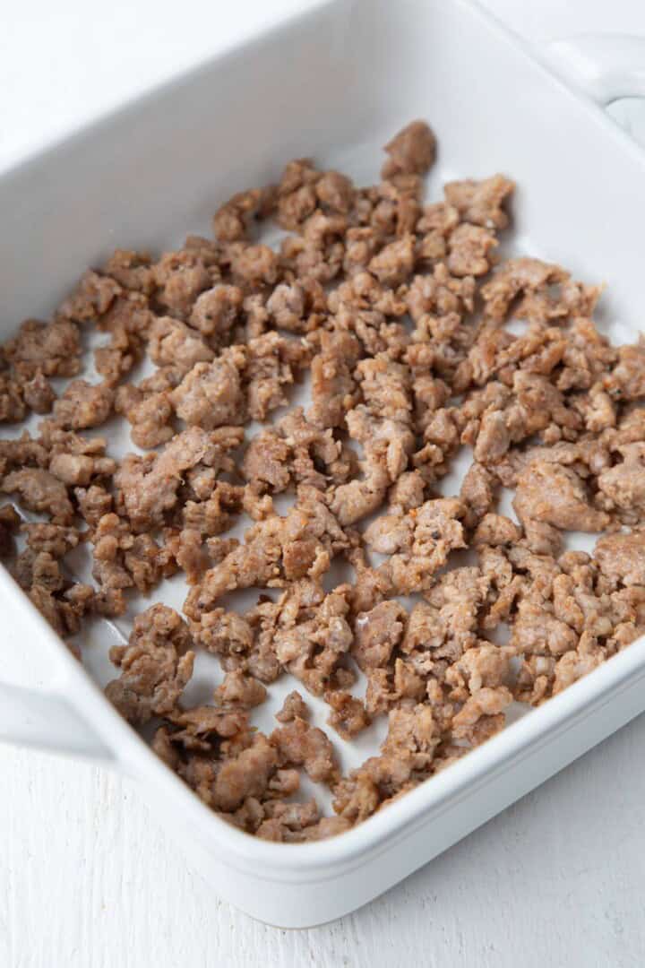 cooked sausage in a casserole dish.