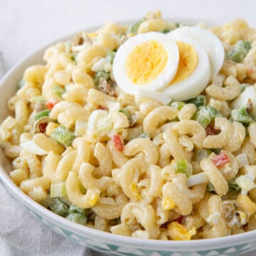 old fashioned macaroni salad with chopped olives and hard boiled eggs.
