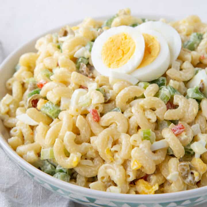 old fashioned macaroni salad with chopped olives and hard boiled eggs.