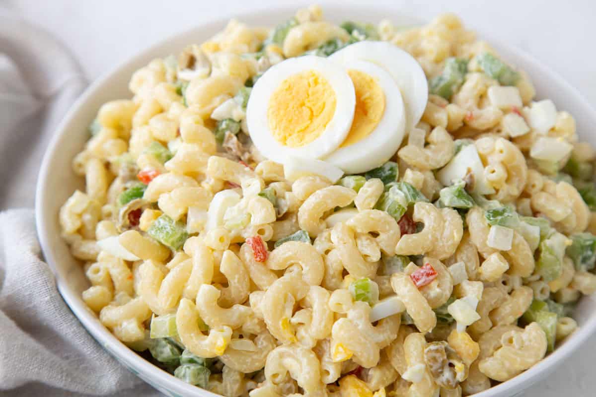old fashioned macaroni salad with olives and sliced hard boiled eggs.