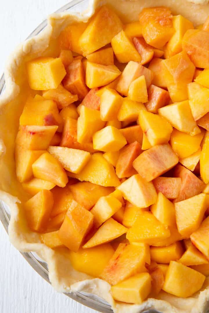 chopped peaches in a pie crust.