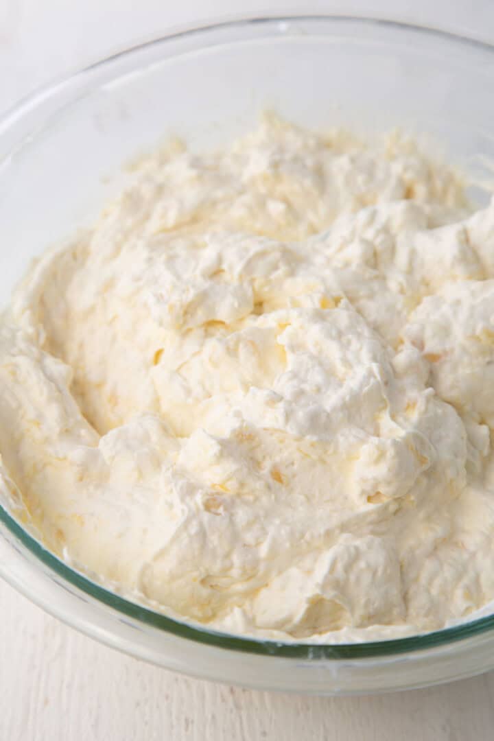 fluffy cool whip frosting with pineapple.