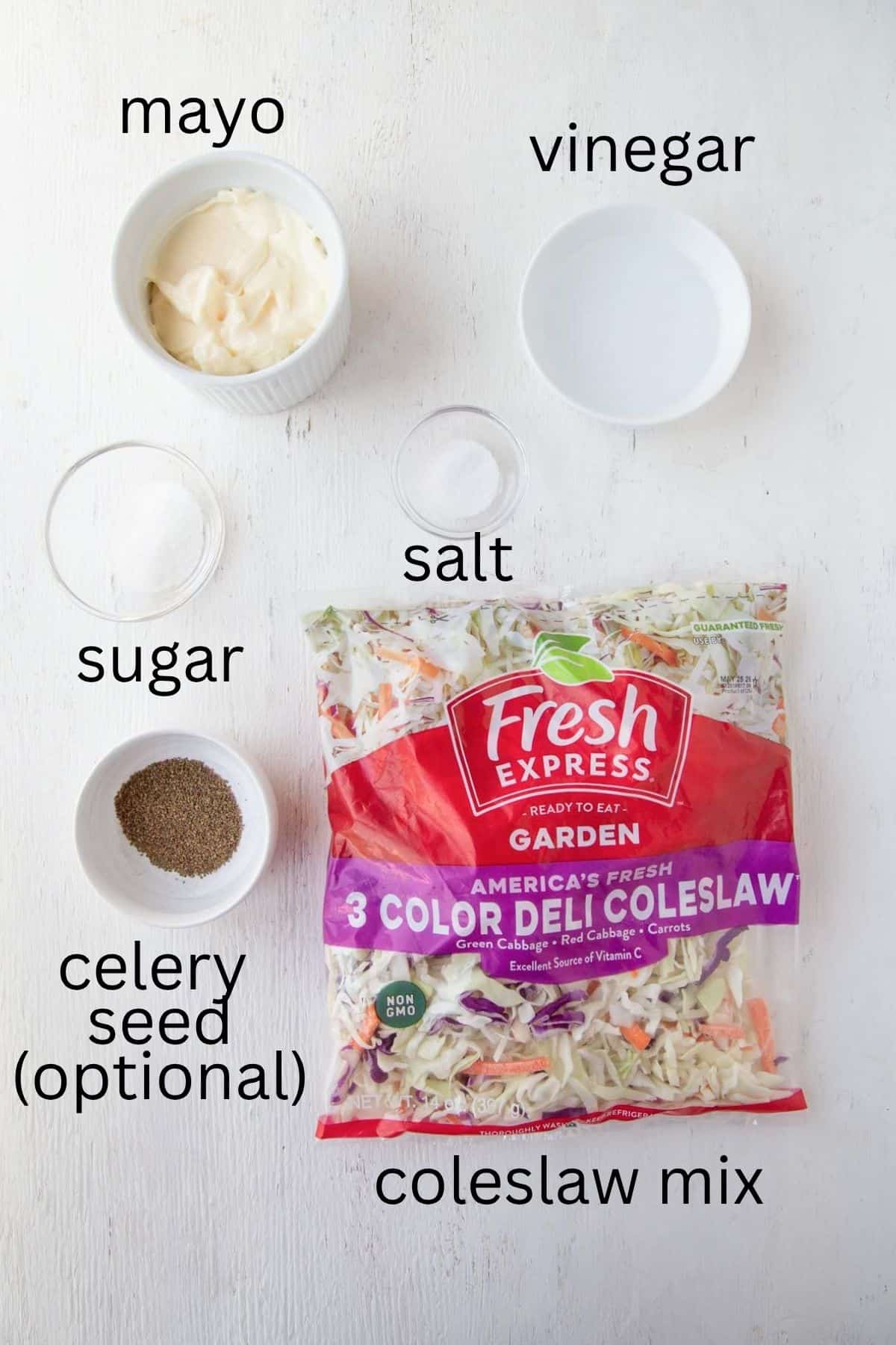 a bag of coleslaw mix, mayo, sugar, vinegar, salt, and celery seed.