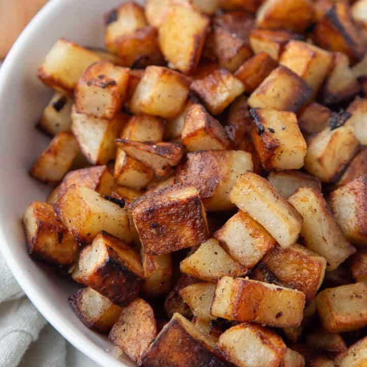 crispy home fried potatoes cut into small pieces.