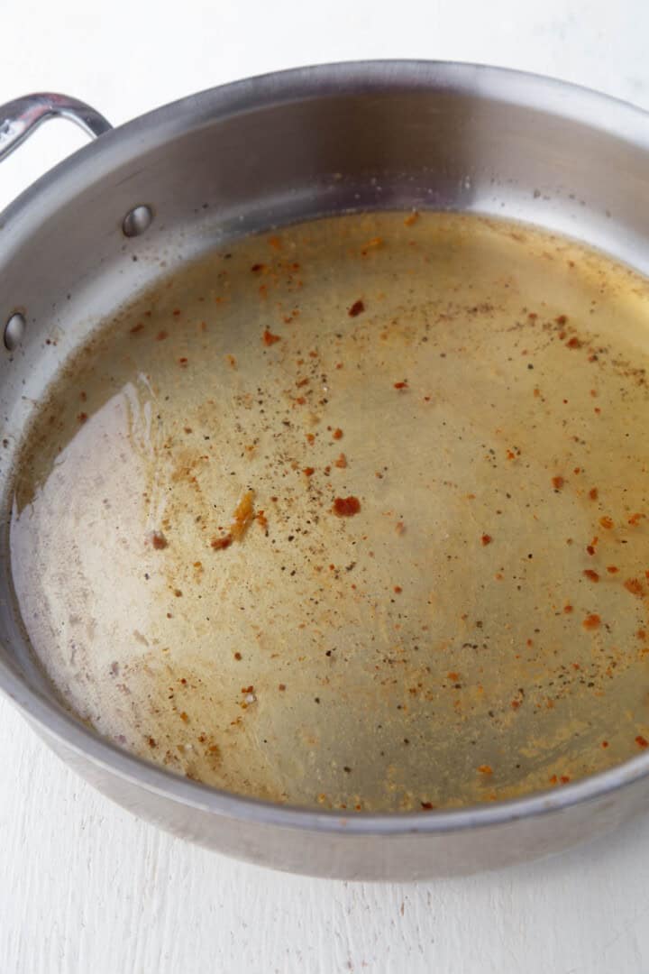bacon grease with sugar and vinegar in a large saucepan.