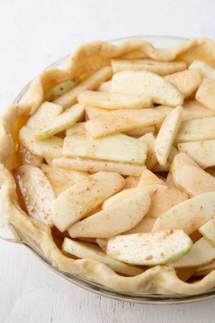 sliced apples in an unbaked pastry crust.