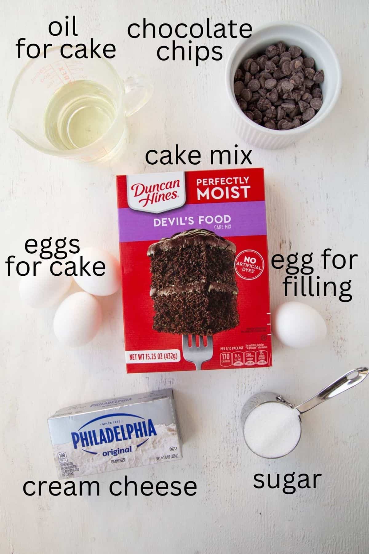 cake mix, cream cheese, oil, eggs, sugar, and chocolate chips.