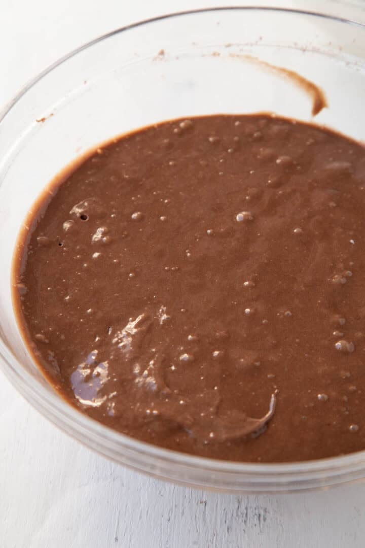 chocolate cake batter in a glass bowl.